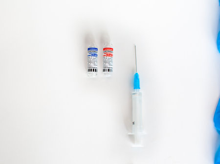 Kemerovo, Russia, July 2021. The coronavirus vaccine is in the hands of a doctor, a syringe. Coronavirus Covid 19 vaccine Sputnik V, local name GamCovidVac, produced in Russia and ready for injectionのeditorial素材