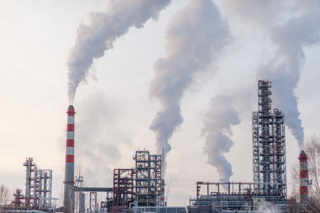 The work of a petrochemical plant. Smoke is coming from the chimney.