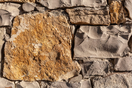 Texture of a stone wall. Old castle stone wall texture background. Stone wall as a background or...