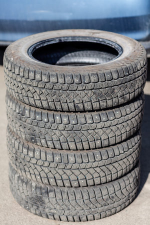 4 new tires that change tires in the auto repair service center, blurred background, the background...