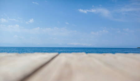 Wooden planks on the pier above the blue sea. Wooden planks on top of the water.の写真素材