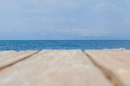 Wooden planks on the pier above the blue sea. Wooden planks on top of the water.の写真素材