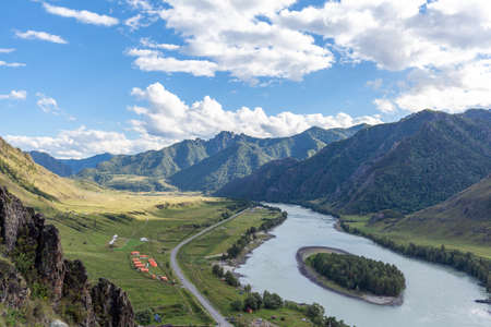 Colorful view of the mountains and the Katun River, with an island in the Altai Mountains, Siberia, Russia. View from the observation deck in the mountains. The concept of recreation and tourismの写真素材