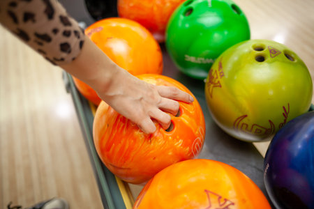 Bowling balls close-up. Paths with balls and pins for bowling. A fun game for the company.の写真素材