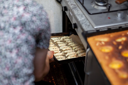The process of making homemade croissants and other pastries at home. The family is cooking dessert together in the kitchen.の写真素材