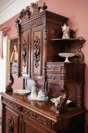 11/29/2022, Cherepovets, Vologda region, Russia. Museum House of IA Milyutin on Cathedral Hill house-museum of the Cherepovets head of the XIX century. Different rooms and antique furniture dishesのeditorial素材