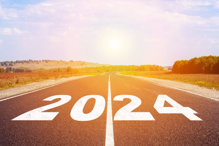 2024 written on highway road in the middle of empty asphalt road
