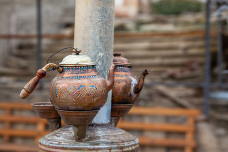 An old Turkish wood-burning samovar with two copper kettles near a cafe for vacationing tourists.の写真素材