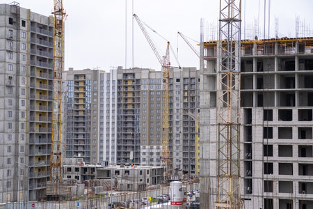 Builders work on large construction sites, and there are many cranesのeditorial素材