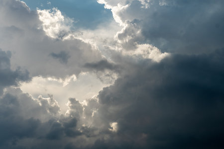 Dramatic sky with grey clouds over the city before the storm.の写真素材