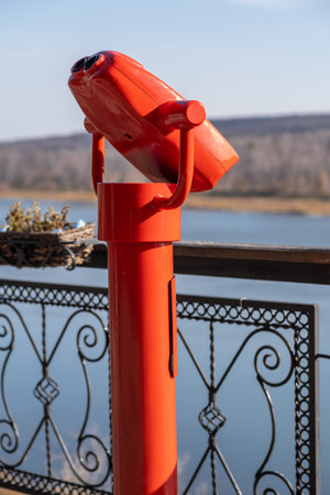 Public stationary binoculars on the banks of the river in summerの写真素材