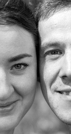 Close-up of the man and womans face close to each other.