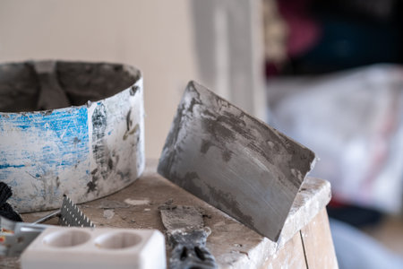 Applying decorative putty. White abstract texture of surface covered with putty