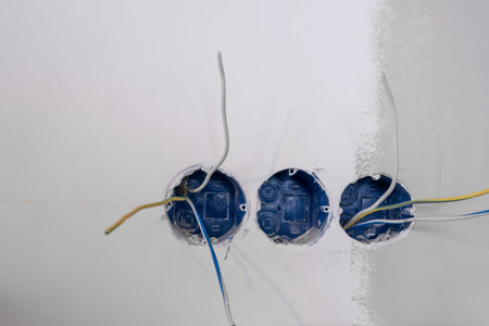Apartment renovation. Electrical wiring. Wires sticking out of the wall.