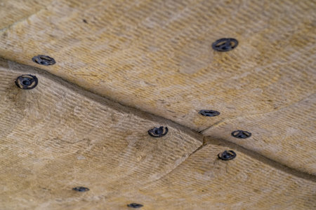 Insulation panels made of mineral wool, which were glued to the ceiling.