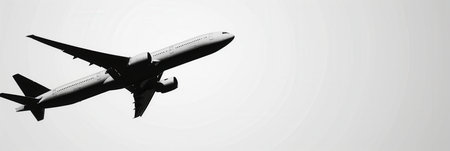 A minimalistic silhouette of an airplane in flight, perfect for airlines and flight booking agencies.の素材