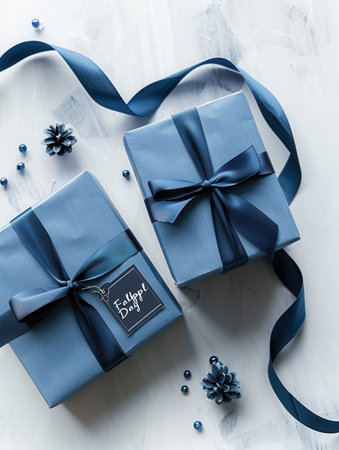 A festive Fathers Day image featuring two elegantly wrapped blue gift boxes adorned with dark blue ribbons and a Happy Fathers Day tag.の素材