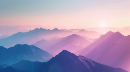 A tranquil scene of mountains at dawn, illuminated by the first rays of the sun, with soft pastel hues in the sky.の素材