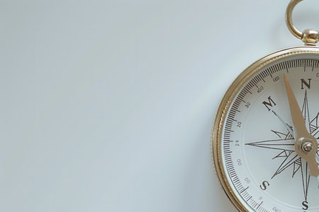 A classic compass with a clean design on a white background, ideal for navigation and travel-related visuals.の素材