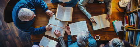 A group of elderly people collaborated on learning foreign languages using textbooks and dictionaries at a warm, inviting community space.の素材