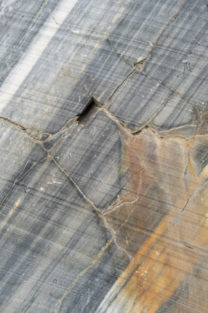 Close-up view of beautiful marble displaying dynamic patterns and colors, highlighting its intricate texture and natural formationsの写真素材