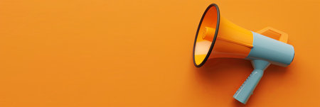 A colorful megaphone rests against a vibrant orange background, perfect for making announcements or engaging in events.の素材