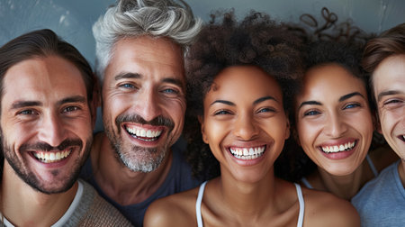 Five friends of different backgrounds share a moment of happiness, smiling brightly in a cozy, cheerful indoor environment.の素材