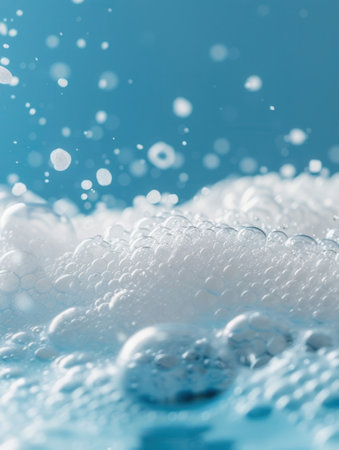 A soothing bath filled with fluffy white foam creating a serene atmosphere, perfect for unwinding after a long day.の素材