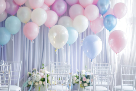 A stunning display of white and pastel balloons adorns the venue for a wedding ceremony, creating a romantic atmosphere.の素材