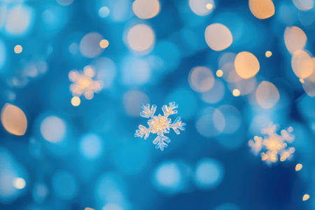 Delicate snowflakes shimmer and gently descend against a soothing blue backdrop, evoking a tranquil winter wonderland.の素材