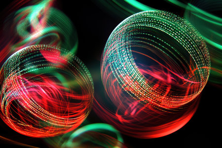 Bright red and green ornaments swirl against a dark background, illuminated by twinkling lights, evoking holiday cheer and celebration.の素材