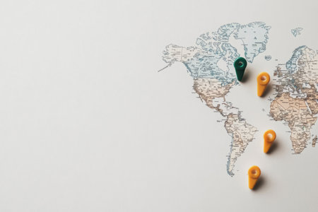 A world map outline features vibrant pins highlighting popular travel destinations for future adventures and exploration.の素材