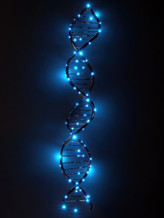 A glowing DNA double helix made from blue lights against a black background highlights its important role in genetics and heredity.の素材