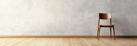 An open space showcases wooden flooring and a blank wall, with a single chair positioned nearby, evoking simplicity and tranquility.の素材