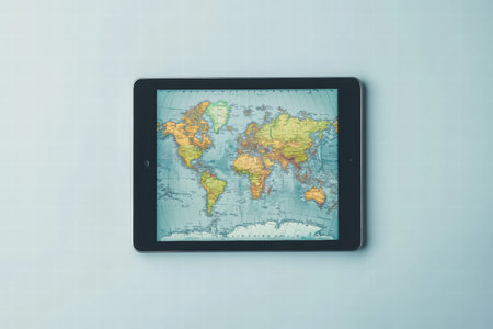 A tablet featuring a detailed world map sits on a clean surface, offering space for customization and modern aesthetic appeal.の素材