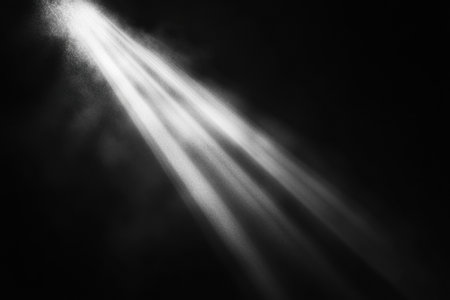 A solitary beam of light emerges from the obscurity, illuminating the darkness with a soft glow, creating a sense of intrigue and calm.の素材