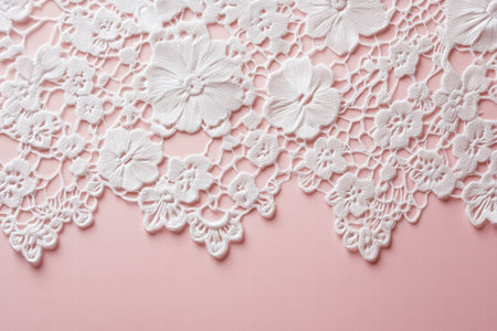 Delicate lace pattern features intricate floral designs against a soft pink background, perfect for various craft projects or textiles.の素材