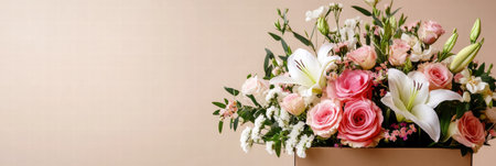 Fresh flowers in shades of pink and white arranged beautifully in a warm chocolate brown delivery box with ample copy space.の素材