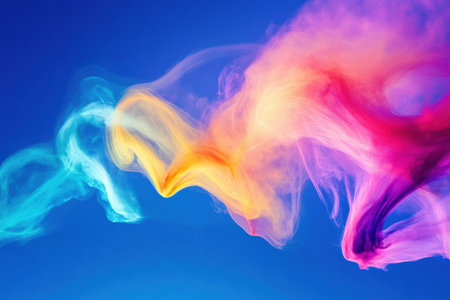 Stunt airplanes execute thrilling maneuvers, leaving vibrant smoke trails in a bright blue sky during an exciting airshow event.の素材