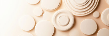 Various circular forms in different sizes and textures are arranged artistically on a smooth surface showing a minimalist aesthetic.の素材