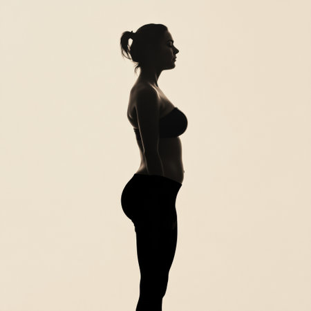 A silhouette of a person reveals significant changes during a weight loss journey, highlighting a healthier physique and commitment to fitness.の素材