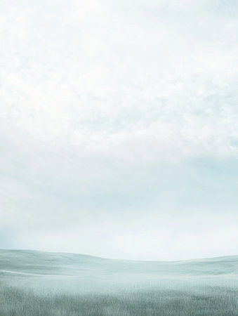 A calming view of gentle hills wrapped in mist at dawn, creating a peaceful atmosphere under a cloudy sky.の素材