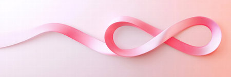 A soft, flowing pink ribbon elegantly loops in a figure eight pattern, representing awareness and support for cancer initiatives.の素材
