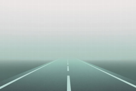 A long, empty road disappears into dense fog, creating a serene yet mysterious atmosphere in the calm morning light.の素材