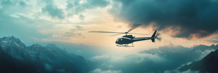 A rescue helicopter navigates through rugged mountain terrain, illuminated by warm light breaking through dark clouds.の素材