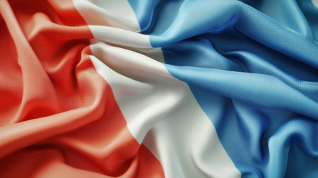 The national flag elegantly flutters in the wind, showing its vibrant colors against a simple backdrop.の素材