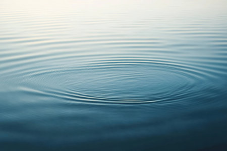 Gentle ripples dance across a calm water surface, reflecting soft light and evoking a serene ambiance, perfect for moments of self-reflection and peace.の素材