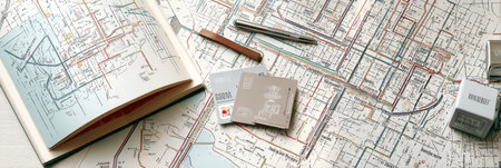 A minimalist city guide and metro card on a map offer essential info for travelers planning their routes.の素材