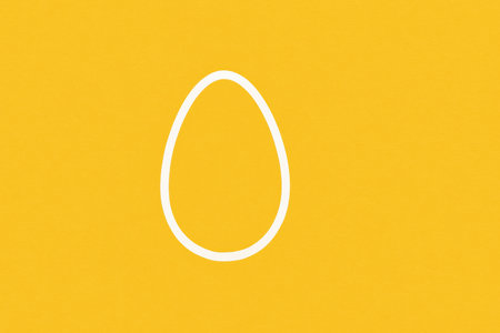 Bright yellow background featuring a minimalist white egg shape, perfect for modern decor or artistic projects.の素材