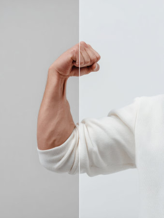 Visual display highlights the contrast between a flexed bicep and a relaxed arm against a clean backdrop, emphasizing muscle tone and anatomy.の素材